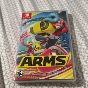 Nintendo ARMS Game with Yellow and Red Cover